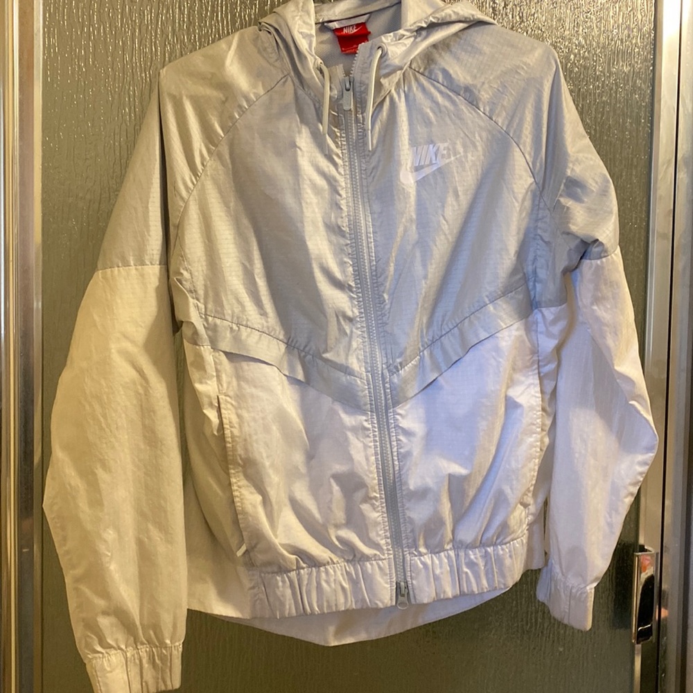 Gray and white Nike windbreaker